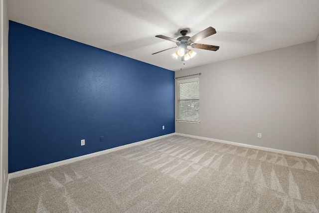 4535 Wandering Vine Trl, Round Rock, TX 78665 - spare room with carpet flooring, ceiling fan, and baseboards
