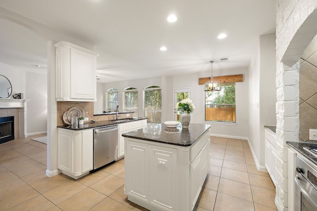 4535 Wandering Vine Trl, Round Rock, TX 78665 - kitchen featuring stainless steel appliances, a sink, recessed lighting, backsplash, and white cabinets