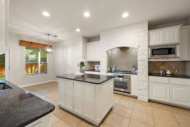 4535 Wandering Vine Trl, Round Rock, TX 78665 - kitchen featuring stainless steel appliances, recessed lighting, light tile patterned floors, backsplash, and white cabinets