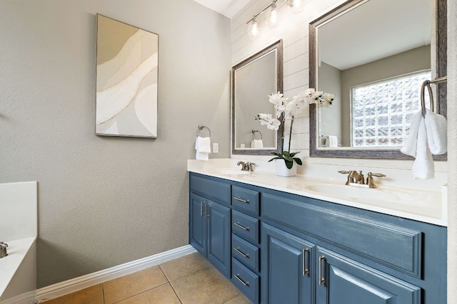 4535 Wandering Vine Trl, Round Rock, TX 78665 - full bath with double vanity, tile patterned flooring, and baseboards