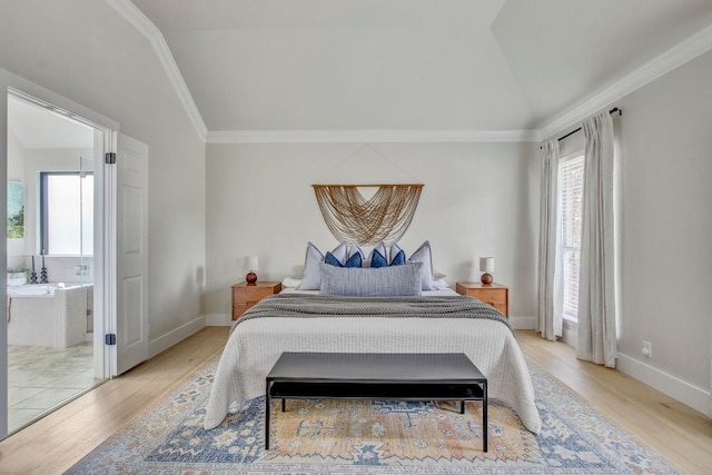 10840 Redmond Rd, Austin, TX 78739 - bedroom with multiple windows, light wood-type flooring, vaulted ceiling, ornamental molding, and connected bathroom