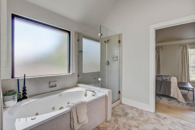10840 Redmond Rd, Austin, TX 78739 - ensuite bathroom featuring a shower stall, a whirlpool tub, baseboards, and tile patterned floors