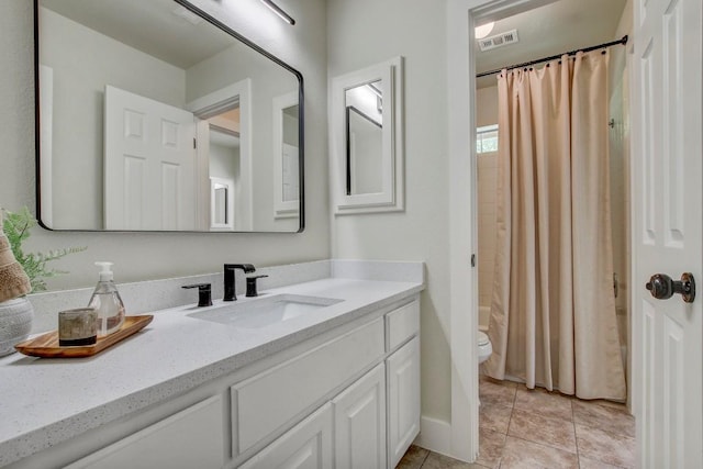 10840 Redmond Rd, Austin, TX 78739 - bathroom featuring vanity, toilet, tile patterned flooring, and shower / tub combo