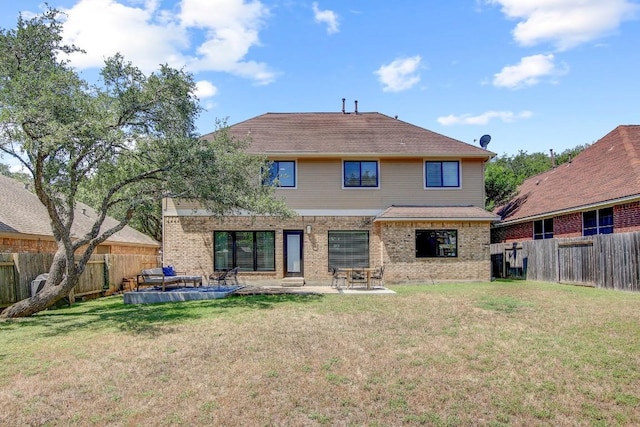 10840 Redmond Rd, Austin, TX 78739 - back of house featuring brick siding and a patio area
