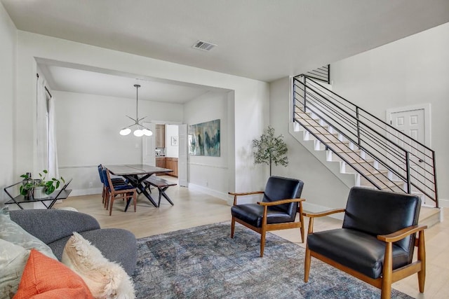 10840 Redmond Rd, Austin, TX 78739 - living area with stairway, light wood-type flooring, and baseboards