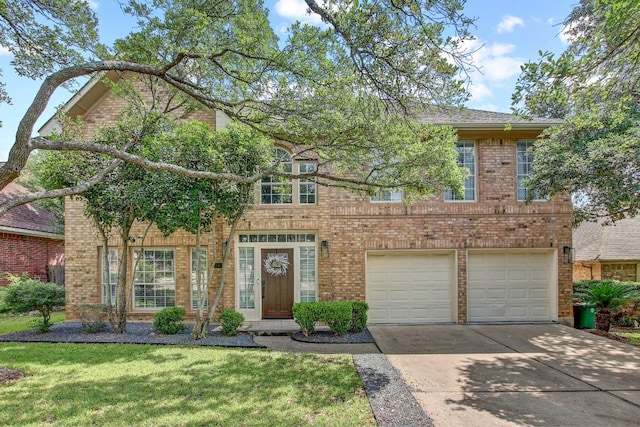 10840 Redmond Rd, Austin, TX 78739 - view of front of home featuring driveway, a garage, brick siding, and a front yard