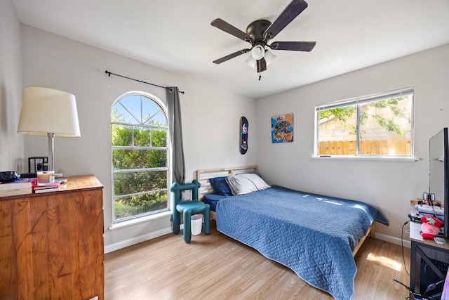 2207 Palmera Cv, Austin, TX 78744 - bedroom with light wood-style floors and baseboards