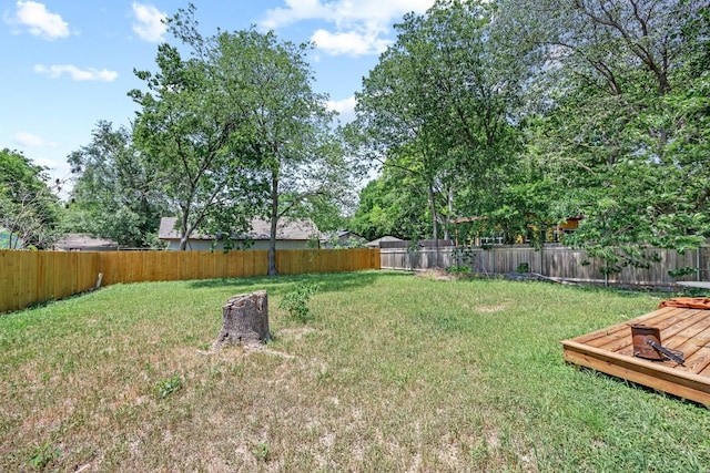2207 Palmera Cv, Austin, TX 78744 - view of yard with a wooden deck