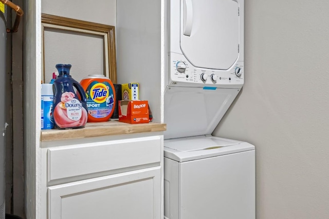 2207 Palmera Cv, Austin, TX 78744 - laundry area with estacked washer and dryer and cabinet space
