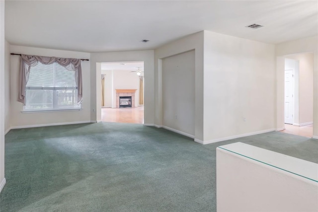 287 Red Poppy Trl, Georgetown, TX 78633 - unfurnished living room featuring carpet floors, a tile fireplace, and baseboards