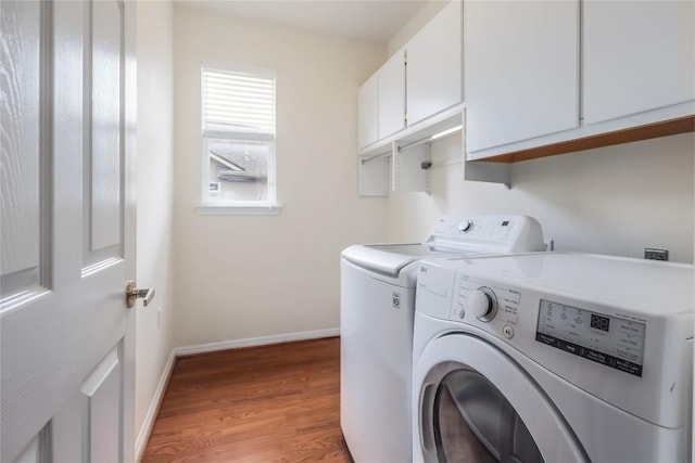 287 Red Poppy Trl, Georgetown, TX 78633 - laundry room featuring cabinet space, washer and clothes dryer, light wood finished floors, and baseboards