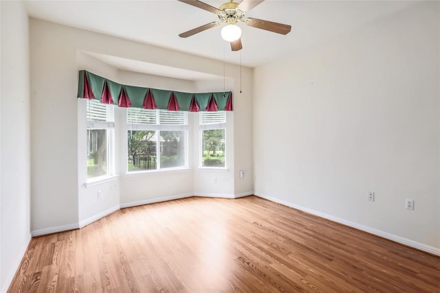 287 Red Poppy Trl, Georgetown, TX 78633 - empty room with wood finished floors, baseboards, and ceiling fan