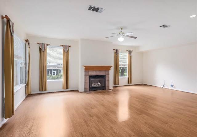287 Red Poppy Trl, Georgetown, TX 78633 - unfurnished living room with light wood-type flooring, healthy amount of natural light, and a ceiling fan