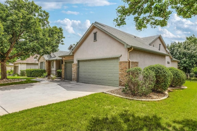 287 Red Poppy Trl, Georgetown, TX 78633 - view of front of house with a garage, stucco siding, concrete driveway, and a front lawn