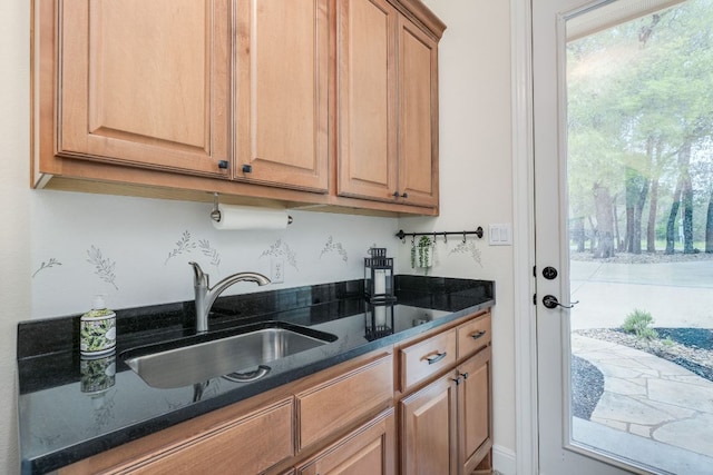 201 Thomas Ridge Rd, Burnet, TX 78611 - kitchen featuring healthy amount of natural light and dark stone counters