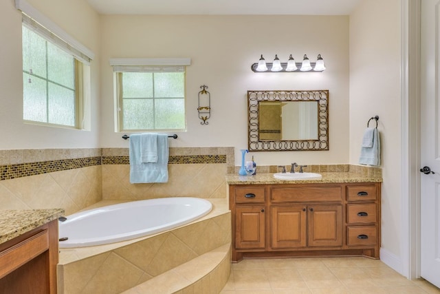201 Thomas Ridge Rd, Burnet, TX 78611 - full bath with vanity, healthy amount of natural light, a bath, and tile patterned flooring
