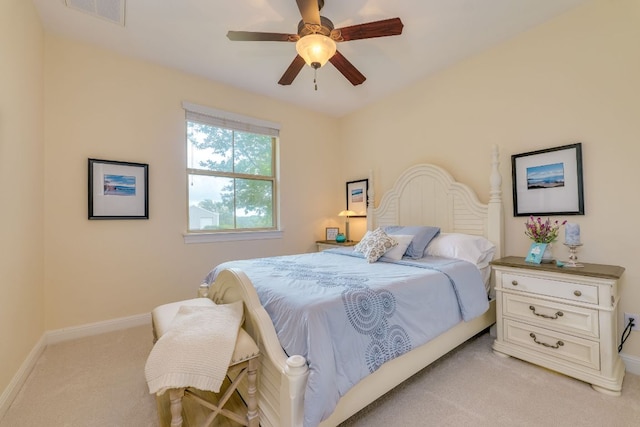 201 Thomas Ridge Rd, Burnet, TX 78611 - bedroom with light carpet, baseboards, and ceiling fan