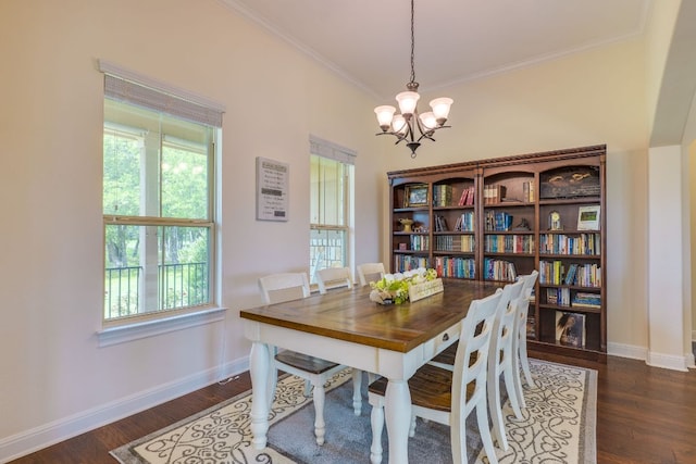 201 Thomas Ridge Rd, Burnet, TX 78611 - dining space featuring a chandelier, crown molding, baseboards, and dark wood-style flooring