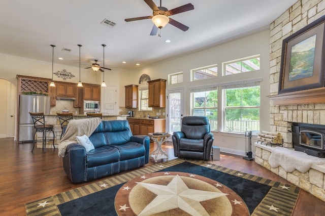 201 Thomas Ridge Rd, Burnet, TX 78611 - living room with ceiling fan, dark wood-type flooring, ornamental molding, baseboards, and recessed lighting