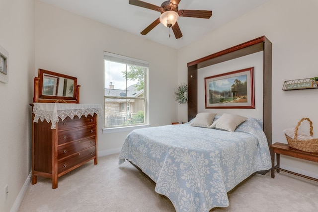 201 Thomas Ridge Rd, Burnet, TX 78611 - bedroom featuring light carpet, baseboards, and ceiling fan