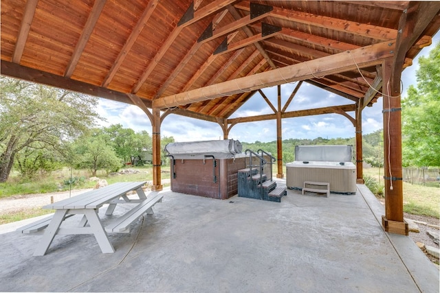 201 Thomas Ridge Rd, Burnet, TX 78611 - view of patio / terrace featuring a hot tub, a gazebo, and outdoor dining space