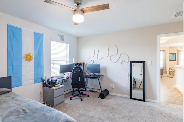 17020 Lathrop Ave, Pflugerville, TX 78660 - bedroom with multiple windows, carpet floors, and an office area