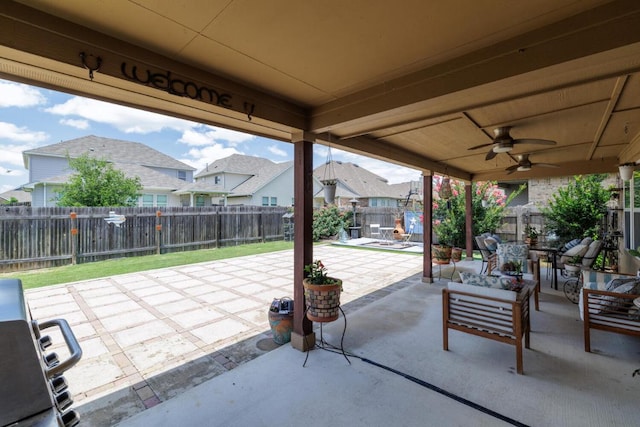 17020 Lathrop Ave, Pflugerville, TX 78660 - fenced backyard with a patio area, a residential view, and a ceiling fan