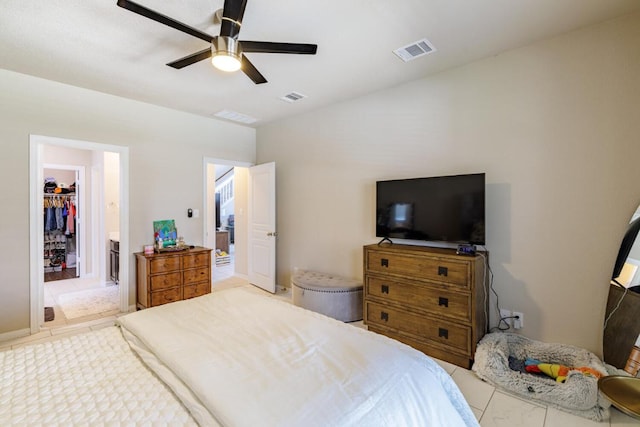 17020 Lathrop Ave, Pflugerville, TX 78660 - tiled bedroom featuring a spacious closet, ceiling fan, and a closet