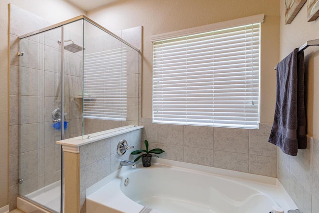 17020 Lathrop Ave, Pflugerville, TX 78660 - bathroom featuring a bath and a shower stall