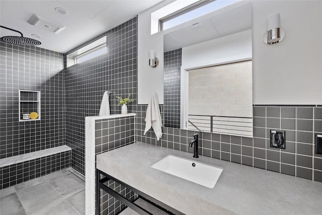 700 Denson Dr Unit 2101, Austin, TX 78752 - bathroom with tile walls, a walk in shower, decorative backsplash, and vanity