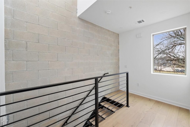 700 Denson Dr Unit 2101, Austin, TX 78752 - stairway featuring wood finished floors and baseboards