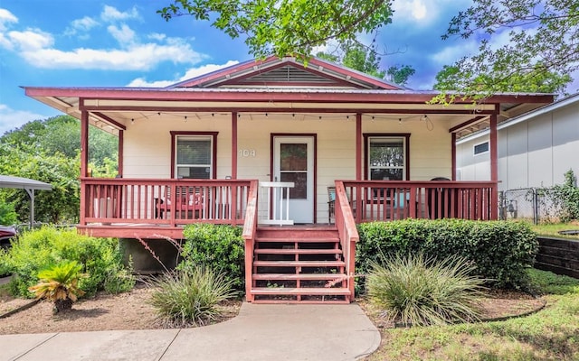 2104 New York Ave, Austin, TX 78702 - view of front of home with a porch and metal roof