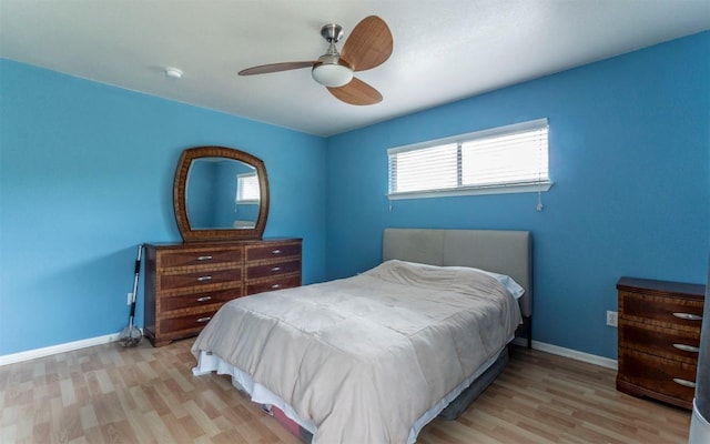 2104 New York Ave, Austin, TX 78702 - bedroom with light wood-style flooring, baseboards, and ceiling fan