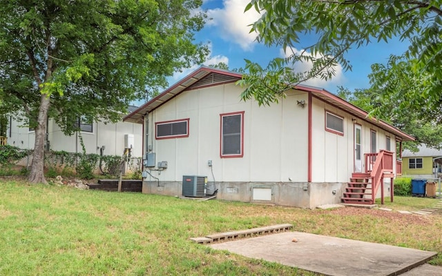 2104 New York Ave, Austin, TX 78702 - view of property exterior with crawl space, cooling unit, and a yard