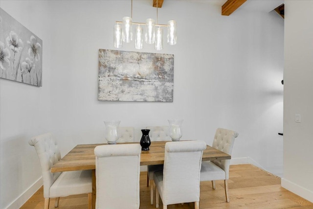 13322 Galleria Cir, Austin, TX 78738 - dining room featuring baseboards, wood finished floors, and beamed ceiling