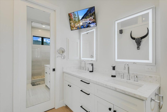13322 Galleria Cir, Austin, TX 78738 - bathroom with double vanity and a shower stall