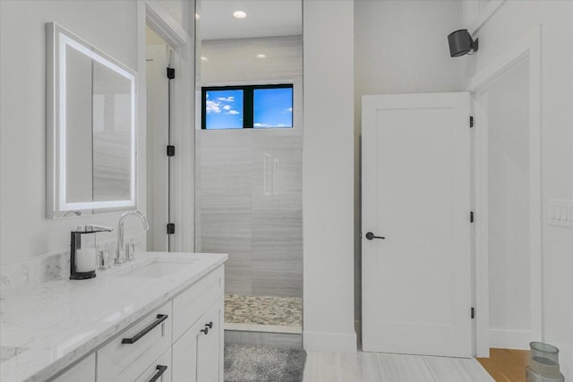 13322 Galleria Cir, Austin, TX 78738 - bathroom with vanity, tiled shower, and recessed lighting