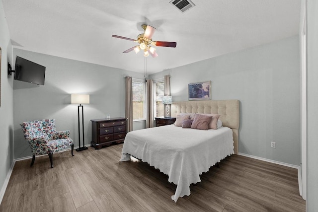 1803 Wallin Loop, Round Rock, TX 78664 - bedroom with wood finished floors, baseboards, and a ceiling fan