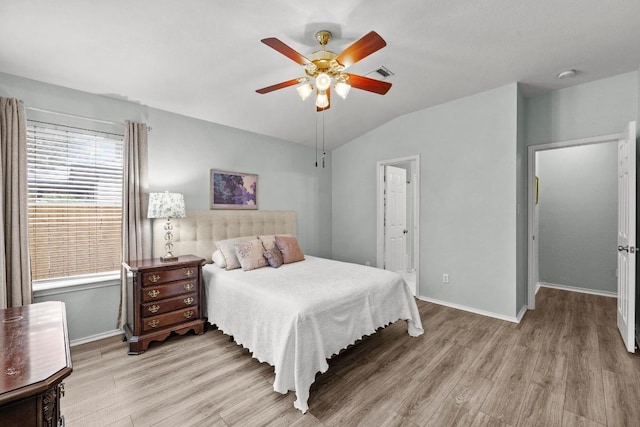 1803 Wallin Loop, Round Rock, TX 78664 - bedroom with wood finished floors, vaulted ceiling, baseboards, and ceiling fan