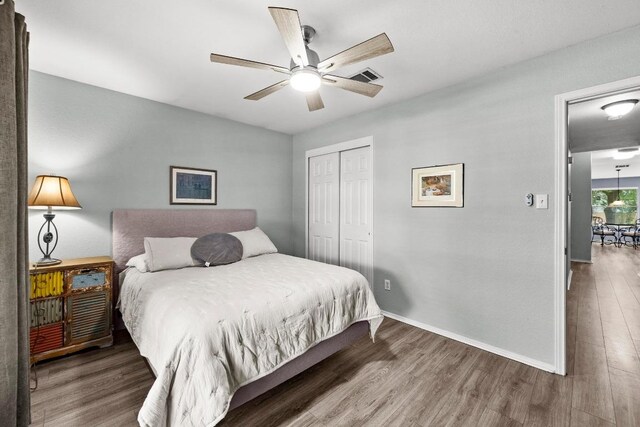 1803 Wallin Loop, Round Rock, TX 78664 - bedroom with wood finished floors, a closet, baseboards, and a ceiling fan