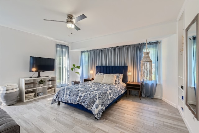 13301 Wisterwood St, Austin, TX 78729 - bedroom with crown molding, wood finished floors, a ceiling fan, and baseboards
