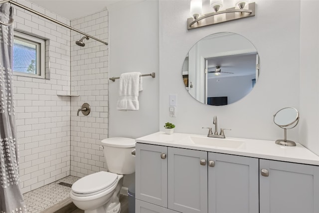 13301 Wisterwood St, Austin, TX 78729 - full bath with a ceiling fan, vanity, toilet, and a tile shower