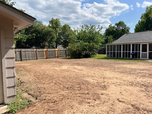 13301 Wisterwood St, Austin, TX 78729 - view of yard with a sunroom
