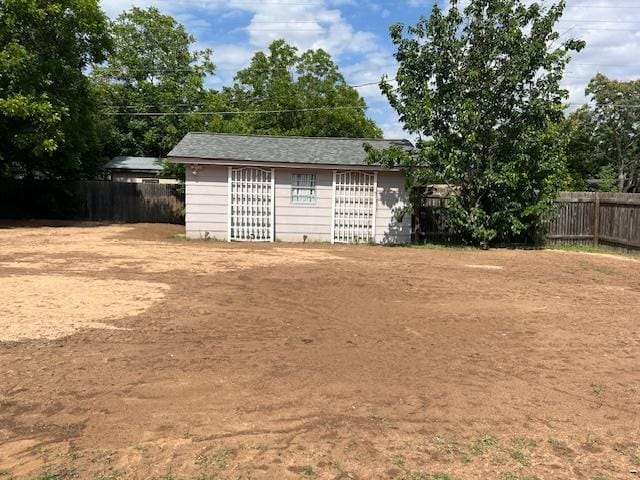 13301 Wisterwood St, Austin, TX 78729 - fenced backyard featuring an outdoor structure