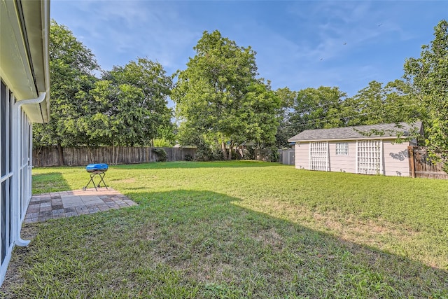 13301 Wisterwood St, Austin, TX 78729 - view of yard with a patio area and an outdoor structure