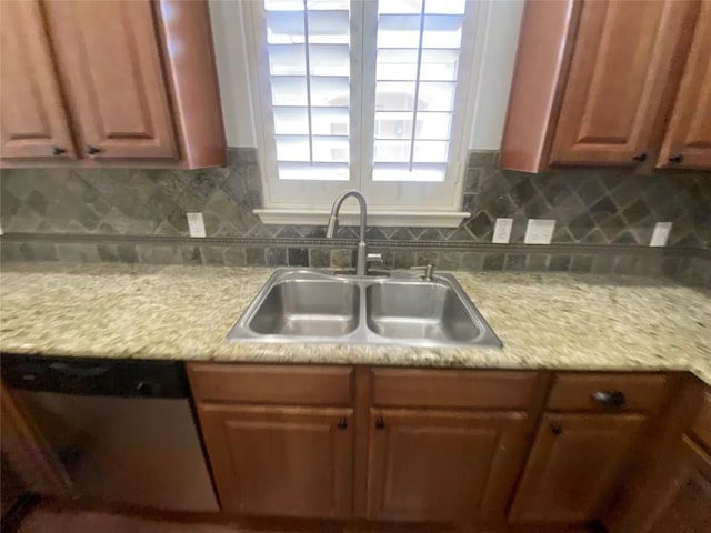 2210 Onion Creek Pkwy Unit 901, Austin, TX 78747 - kitchen featuring a sink, dishwasher, light countertops, and decorative backsplash