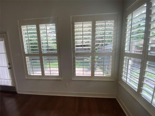 2210 Onion Creek Pkwy Unit 901, Austin, TX 78747 - unfurnished dining area with dark wood-type flooring and baseboards