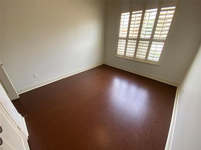 2210 Onion Creek Pkwy Unit 901, Austin, TX 78747 - spare room featuring baseboards and dark wood-style flooring