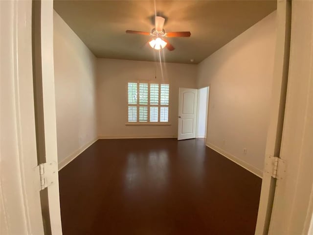2210 Onion Creek Pkwy Unit 901, Austin, TX 78747 - unfurnished room featuring ceiling fan, baseboards, and dark wood-style flooring
