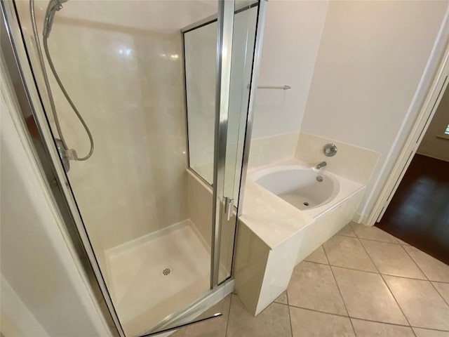 2210 Onion Creek Pkwy Unit 901, Austin, TX 78747 - bathroom with tile patterned flooring, a stall shower, and a bath